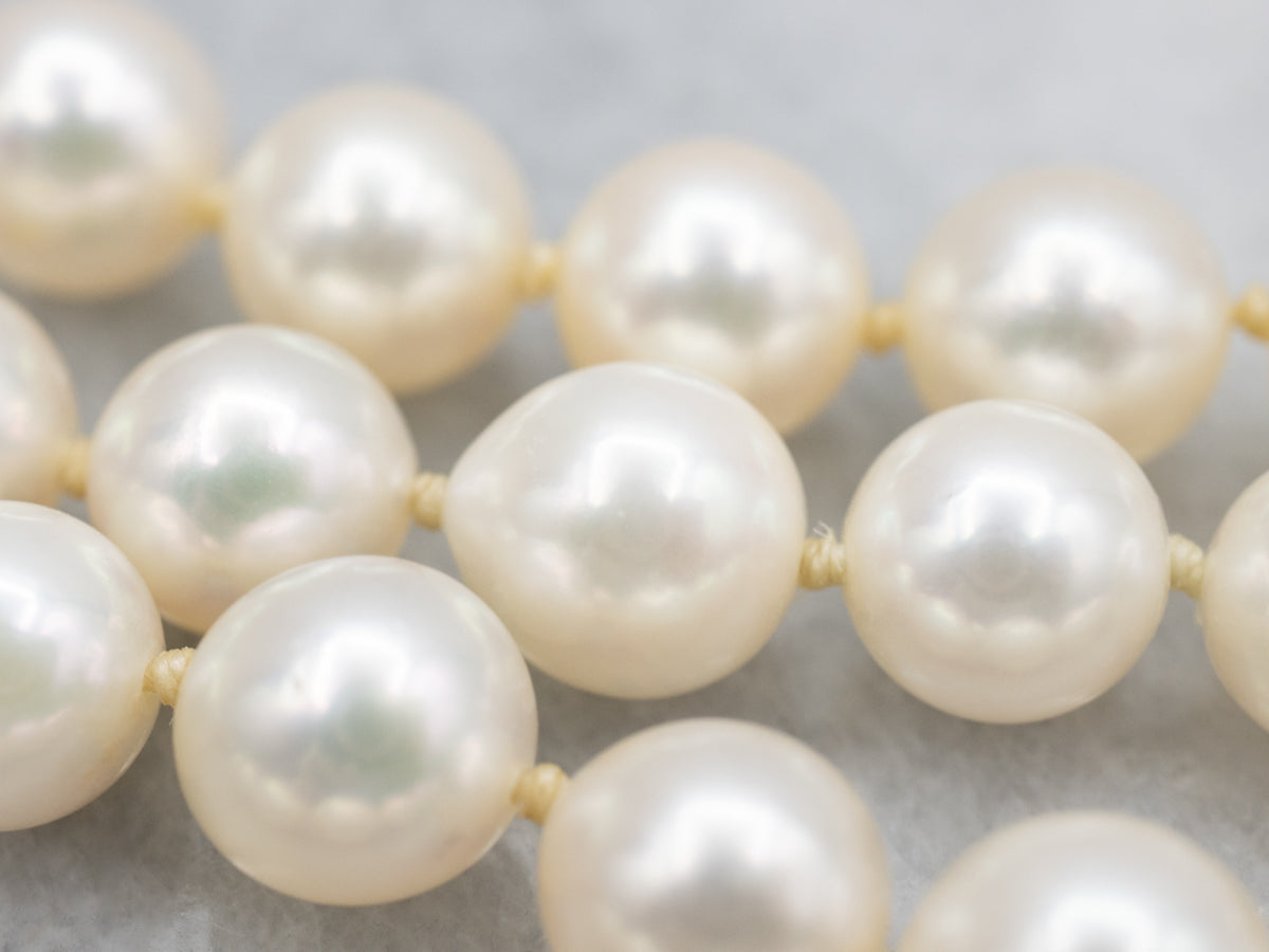 Long Pearl Strand Necklace with Gold Seashell Clasp