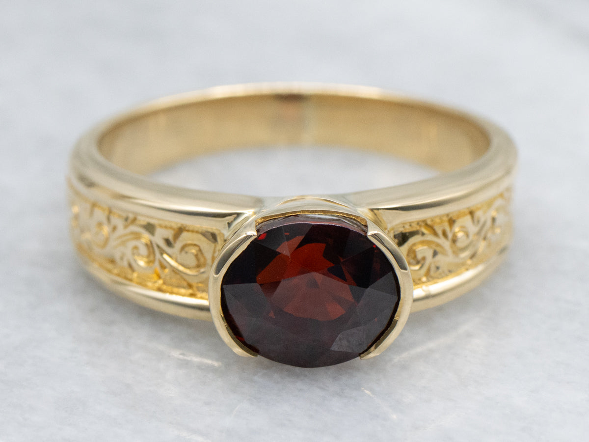 Men's East-to-West Set Garnet Scrolling Engraved Yellow Gold Solitaire Ring