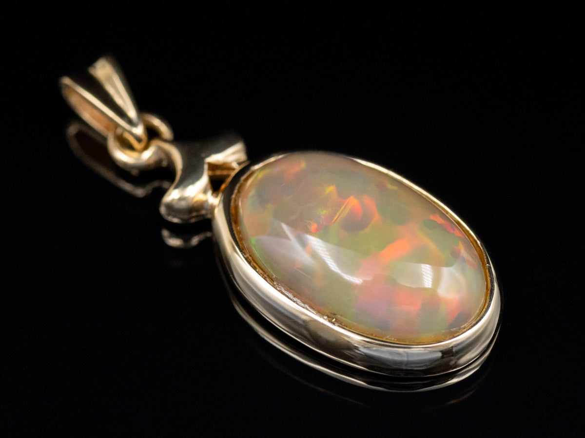 Bezel-Set Opal Cabochon Yellow Gold Pendant