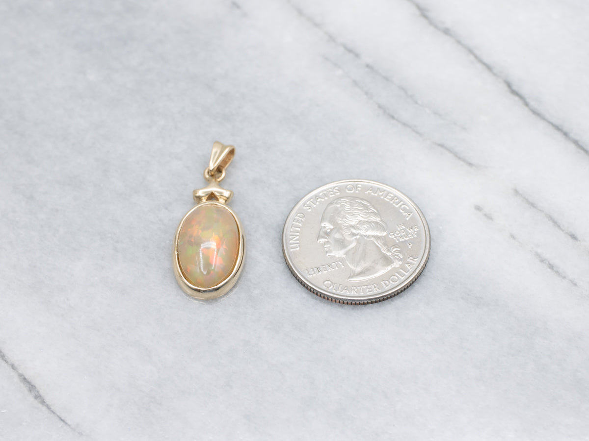 Bezel-Set Opal Cabochon Yellow Gold Pendant