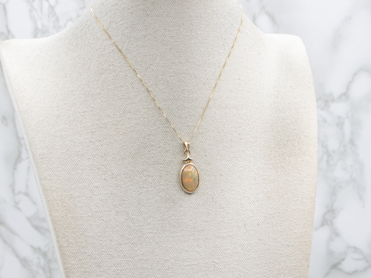 Bezel-Set Opal Cabochon Yellow Gold Pendant
