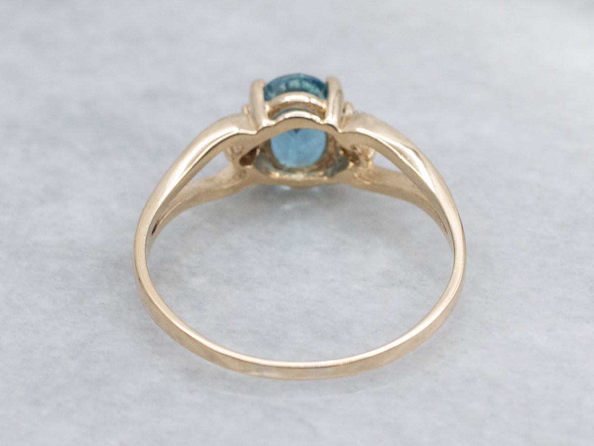 Oval-Cut Blue Topaz and Diamond Accent Yellow Gold Split Shank Ring