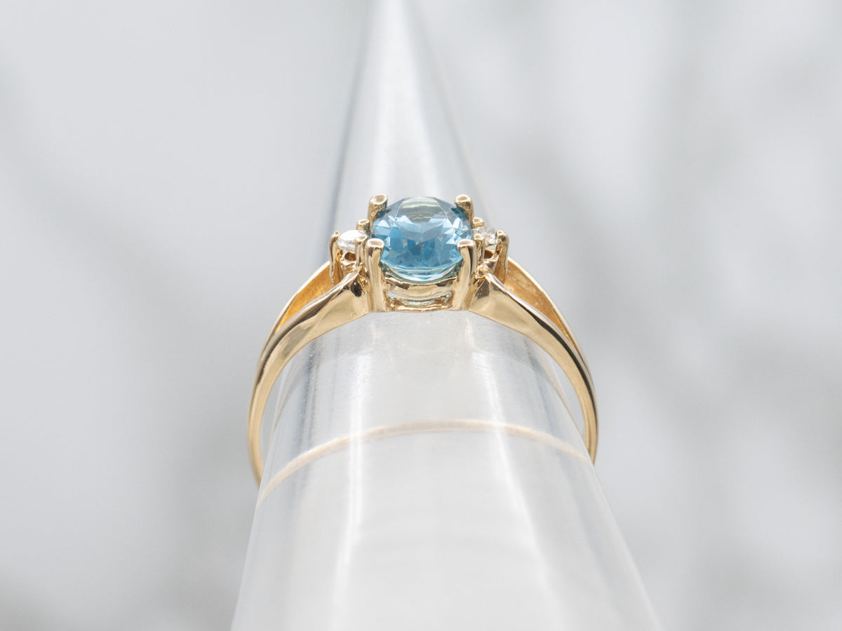 Oval-Cut Blue Topaz and Diamond Accent Yellow Gold Split Shank Ring