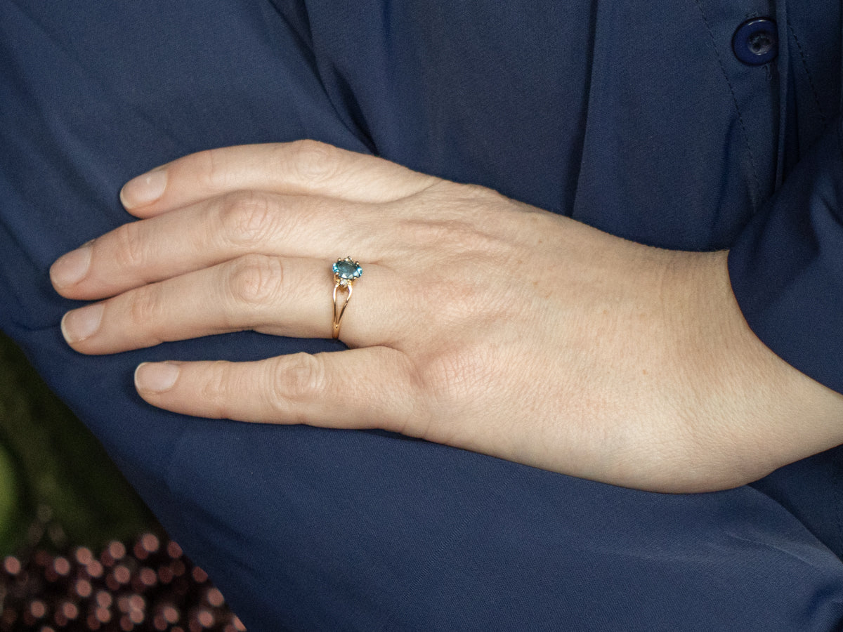 Oval-Cut Blue Topaz and Diamond Accent Yellow Gold Split Shank Ring
