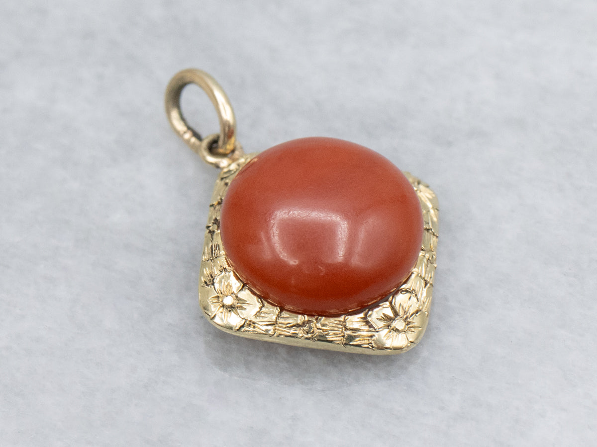 Coral Cabochon and Engraved Gold Floral Pendant