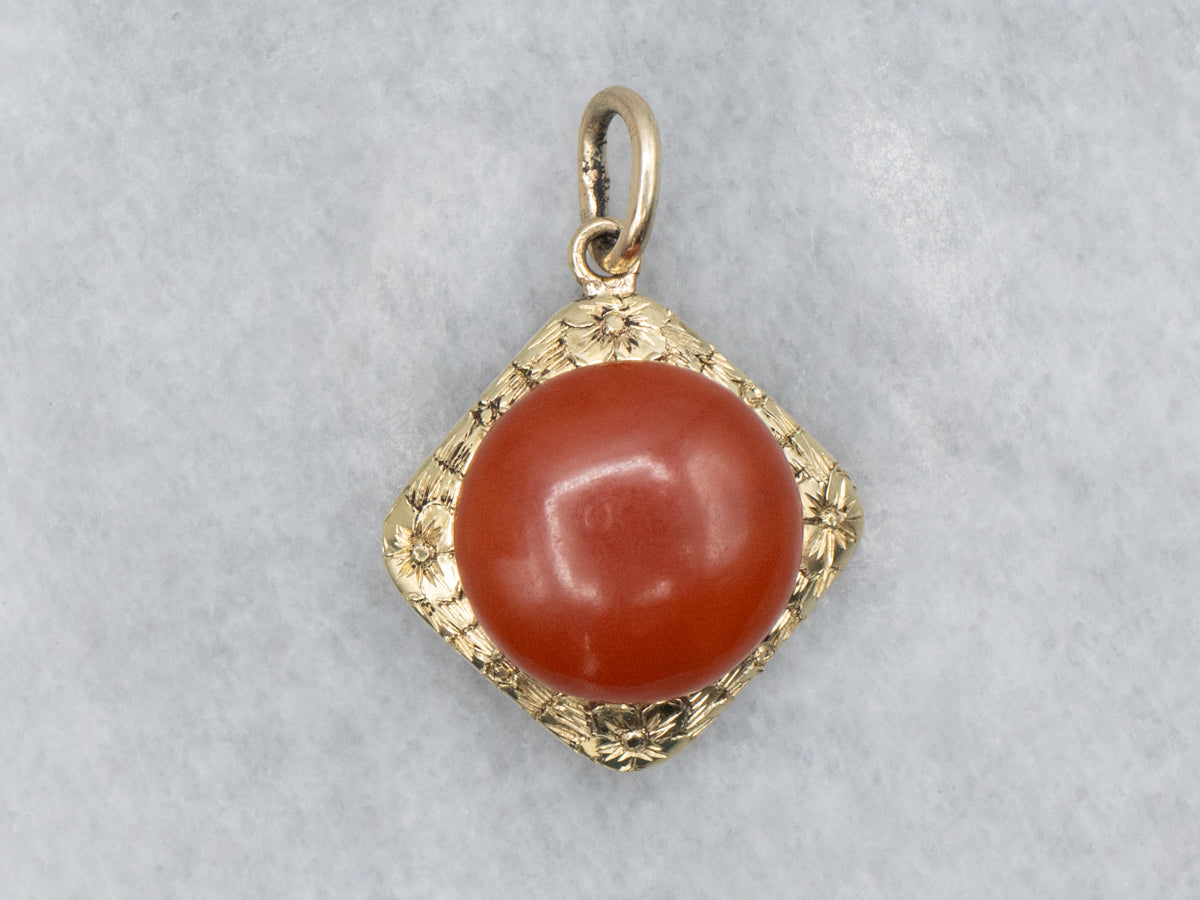 Coral Cabochon and Engraved Gold Floral Pendant