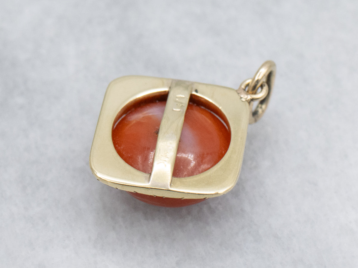 Coral Cabochon and Engraved Gold Floral Pendant