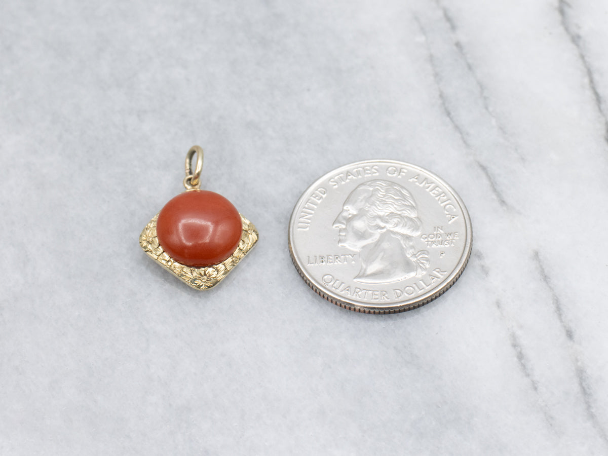 Coral Cabochon and Engraved Gold Floral Pendant