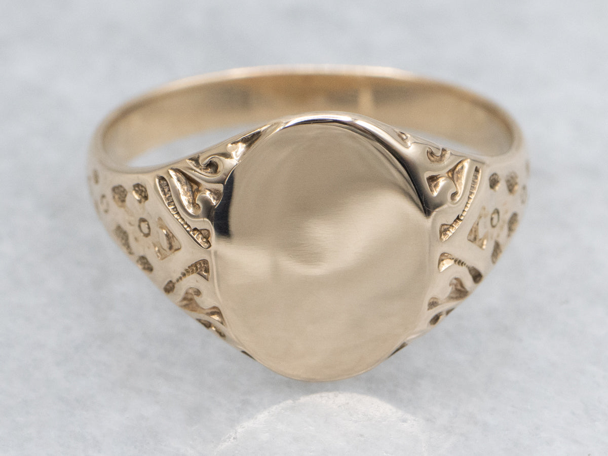 Antique Gold Signet Ring with Ornately Carved Floral Shoulders