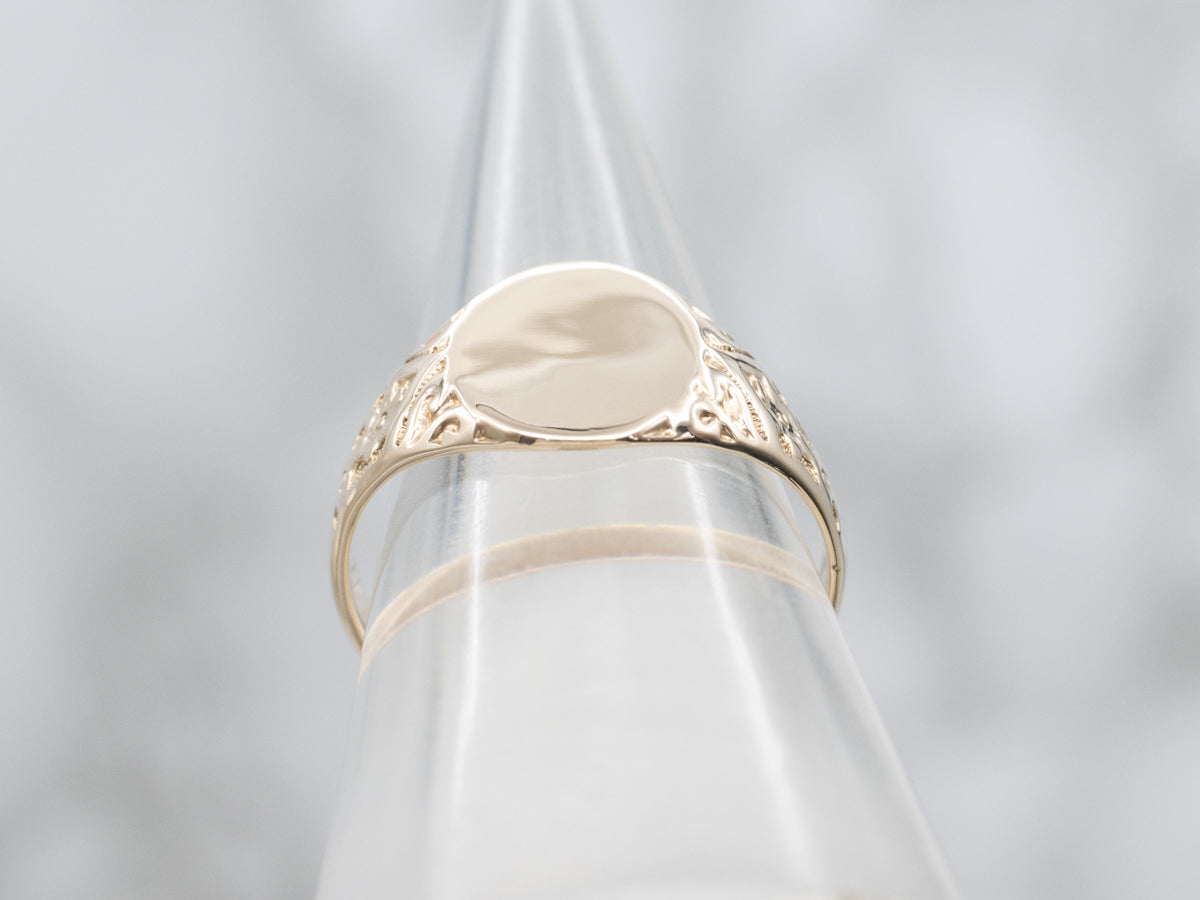 Antique Gold Signet Ring with Ornately Carved Floral Shoulders