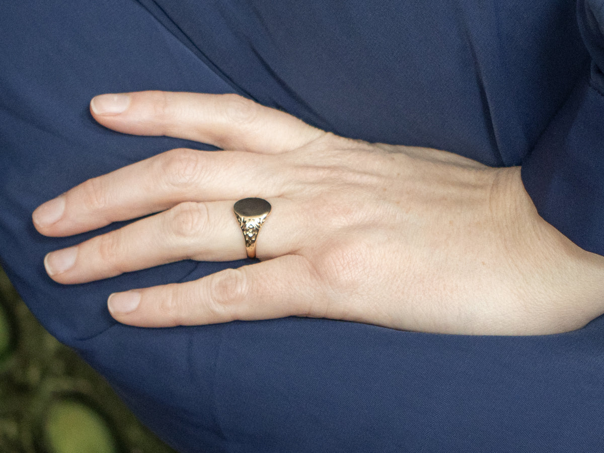 Antique Gold Signet Ring with Ornately Carved Floral Shoulders