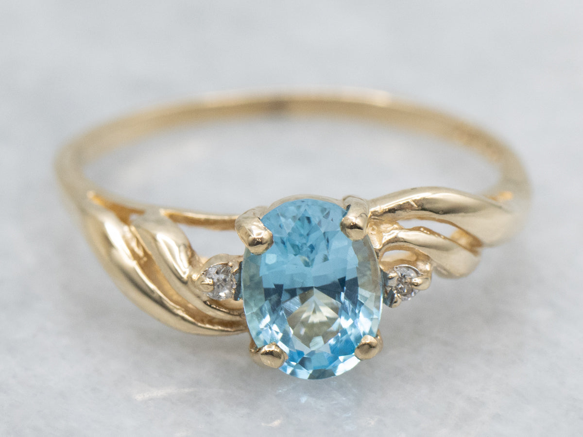 Oval-Cut Blue Topaz and Diamond Yellow Gold Twist Ring