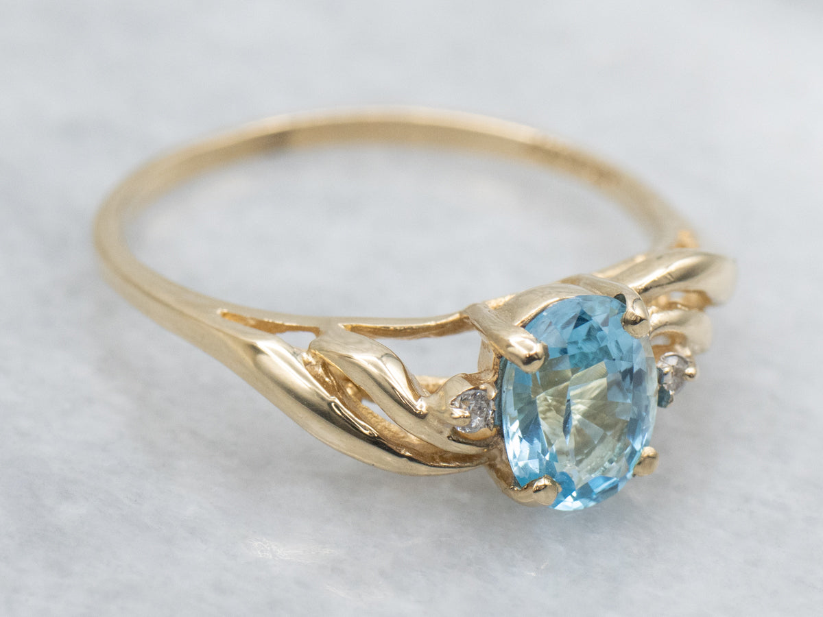 Oval-Cut Blue Topaz and Diamond Yellow Gold Twist Ring