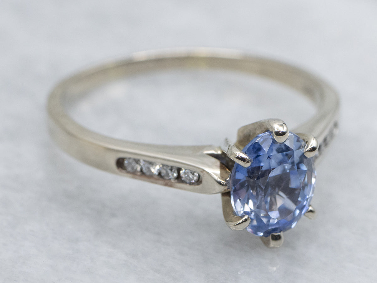 Sapphire White Gold Ring with Channel-Set Diamond Accents