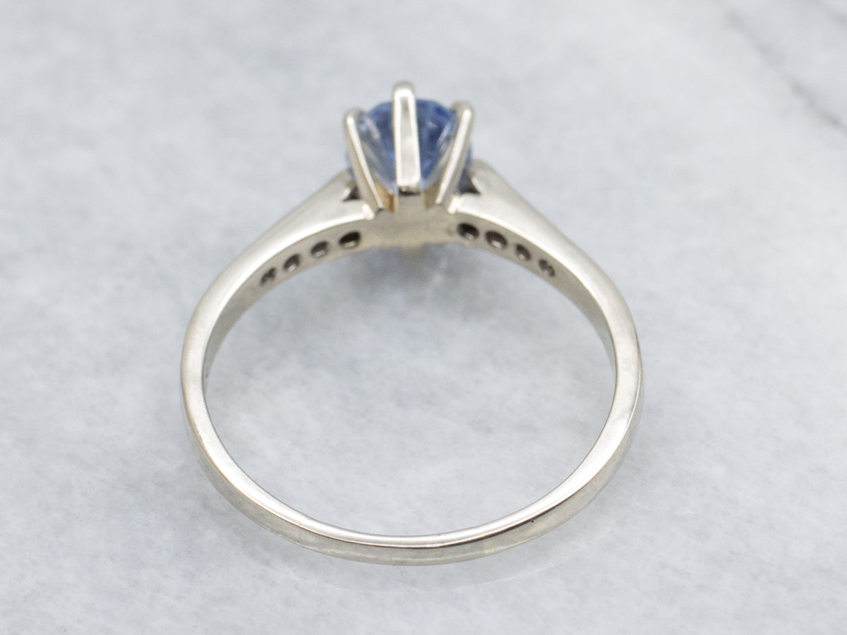 Sapphire White Gold Ring with Channel-Set Diamond Accents