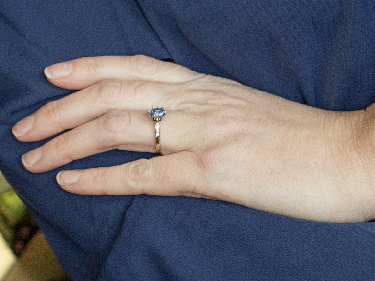 Sapphire White Gold Ring with Channel-Set Diamond Accents