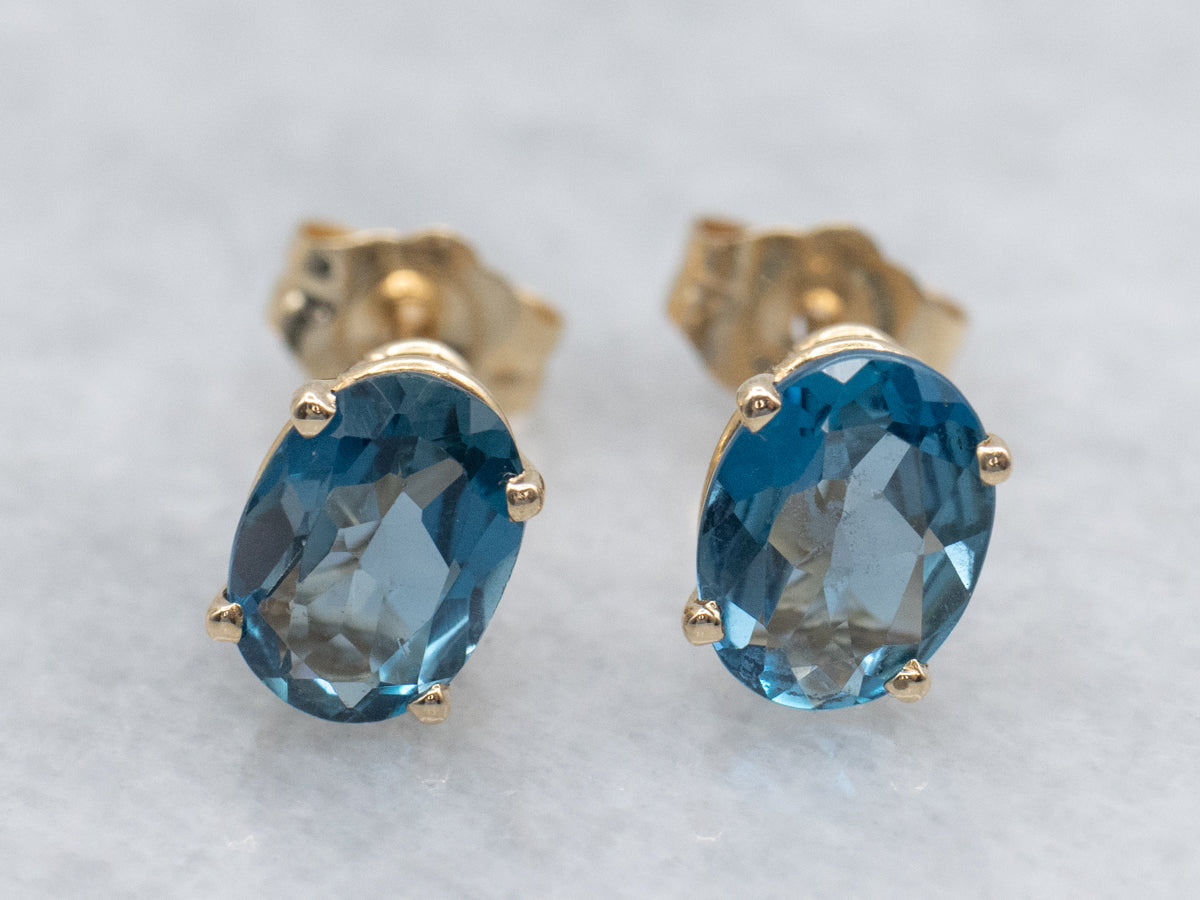 Oval-Cut Blue Topaz Yellow Gold Stud Earrings