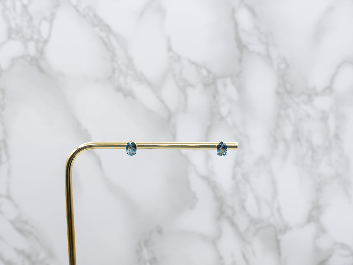 Oval-Cut Blue Topaz Yellow Gold Stud Earrings