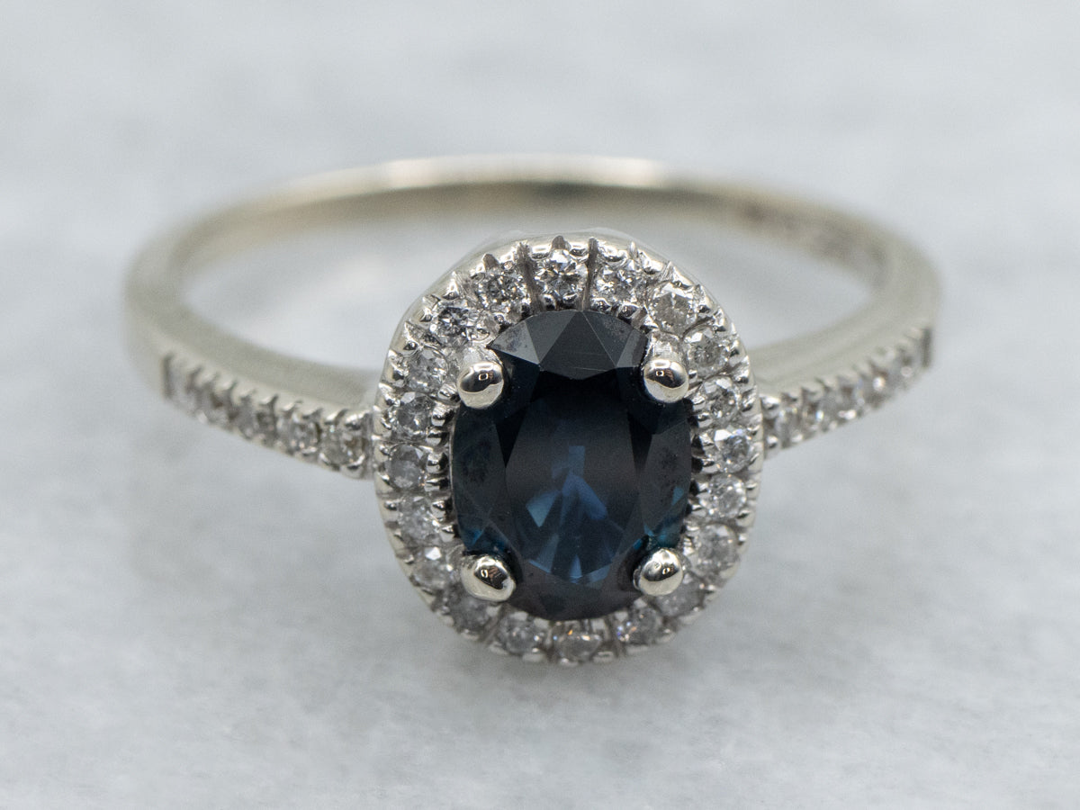 Oval Cut Sapphire and Diamond Halo White Gold Engagement Ring