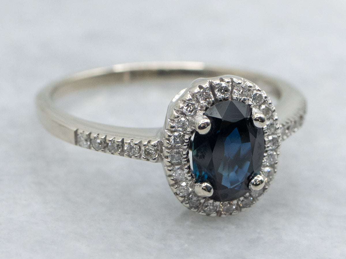 Oval Cut Sapphire and Diamond Halo White Gold Engagement Ring