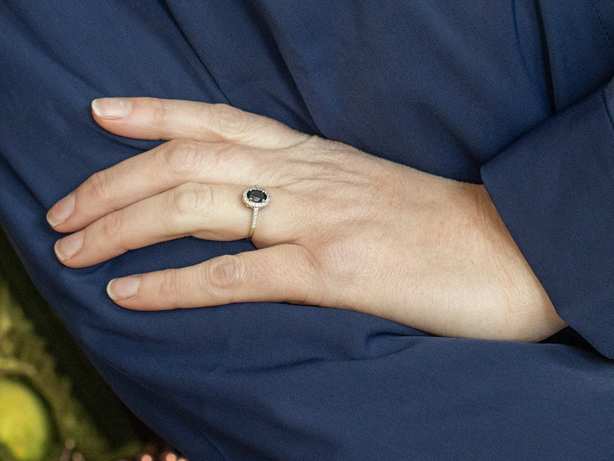 Oval Cut Sapphire and Diamond Halo White Gold Engagement Ring