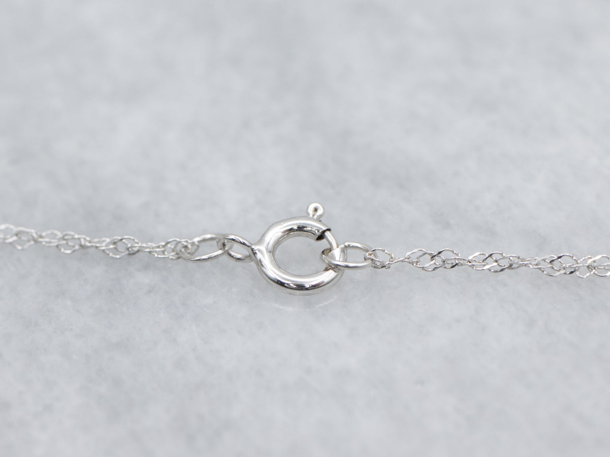 Floral Ruby and Diamond Halo White Gold Pendant Necklace