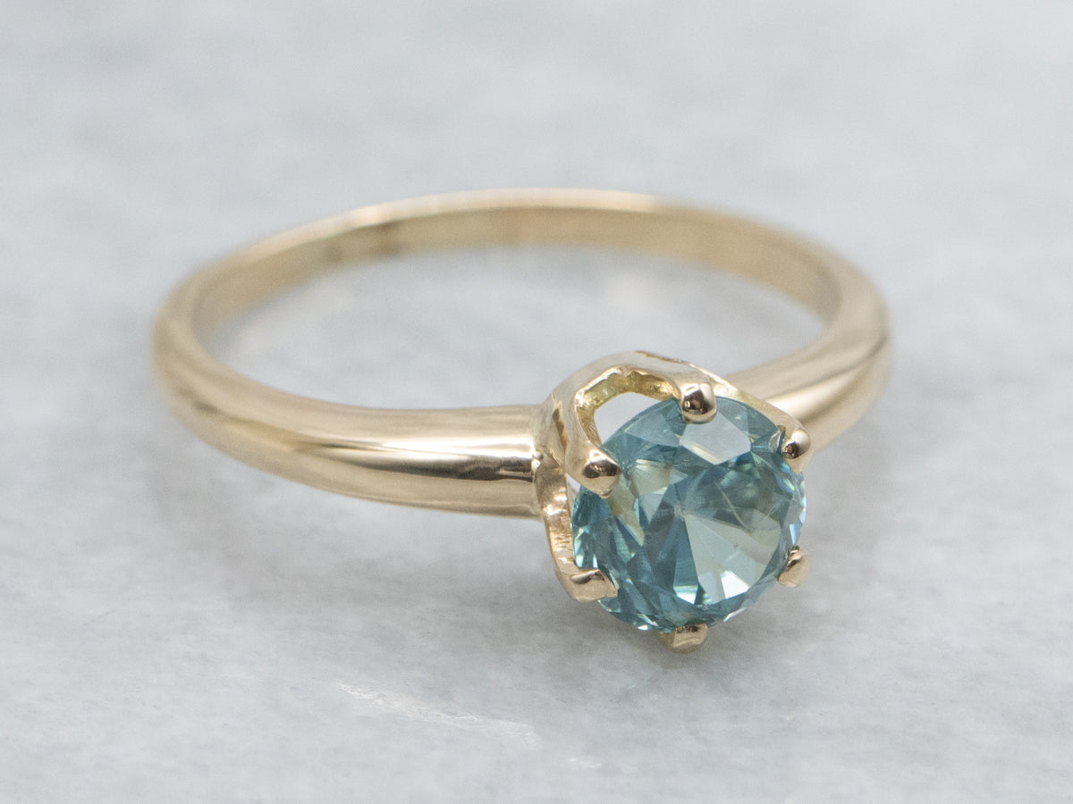 Simple Blue Zircon Solitaire Ring in Yellow Gold