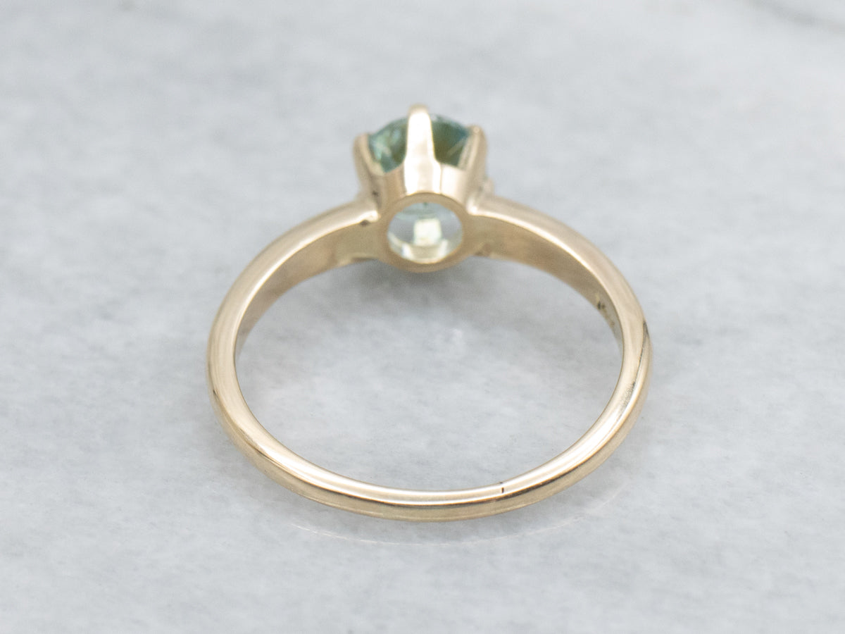 Simple Blue Zircon Solitaire Ring in Yellow Gold