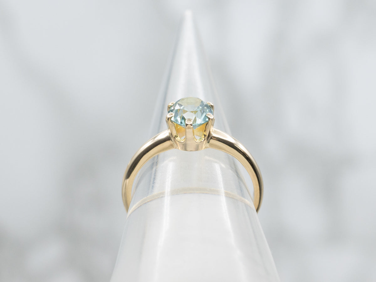 Simple Blue Zircon Solitaire Ring in Yellow Gold
