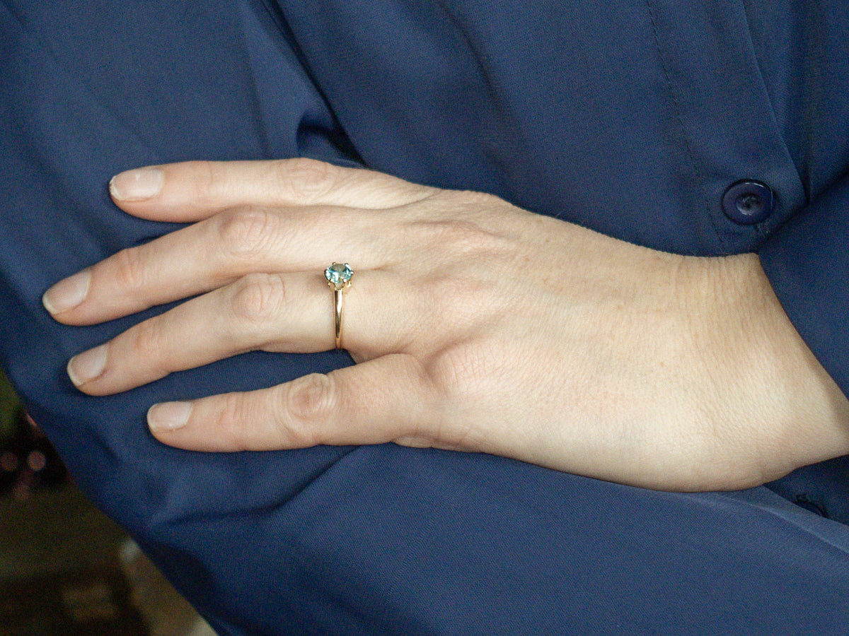 Simple Blue Zircon Solitaire Ring in Yellow Gold