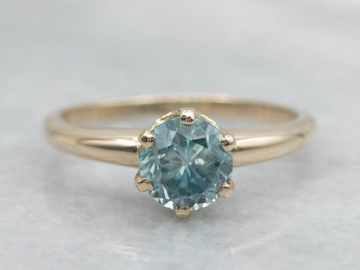 Simple Blue Zircon Solitaire Ring in Yellow Gold