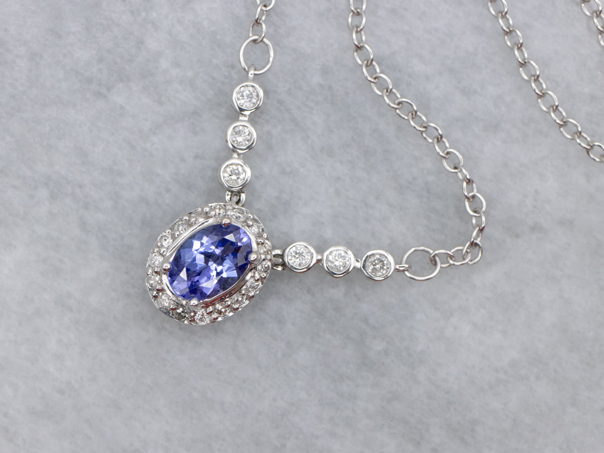 Modern Tanzanite and Diamond Halo Pendant Necklace