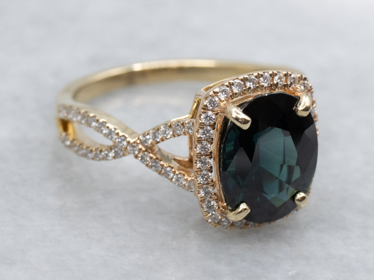 Modern Yellow Gold Sapphire and Diamond Halo Ring