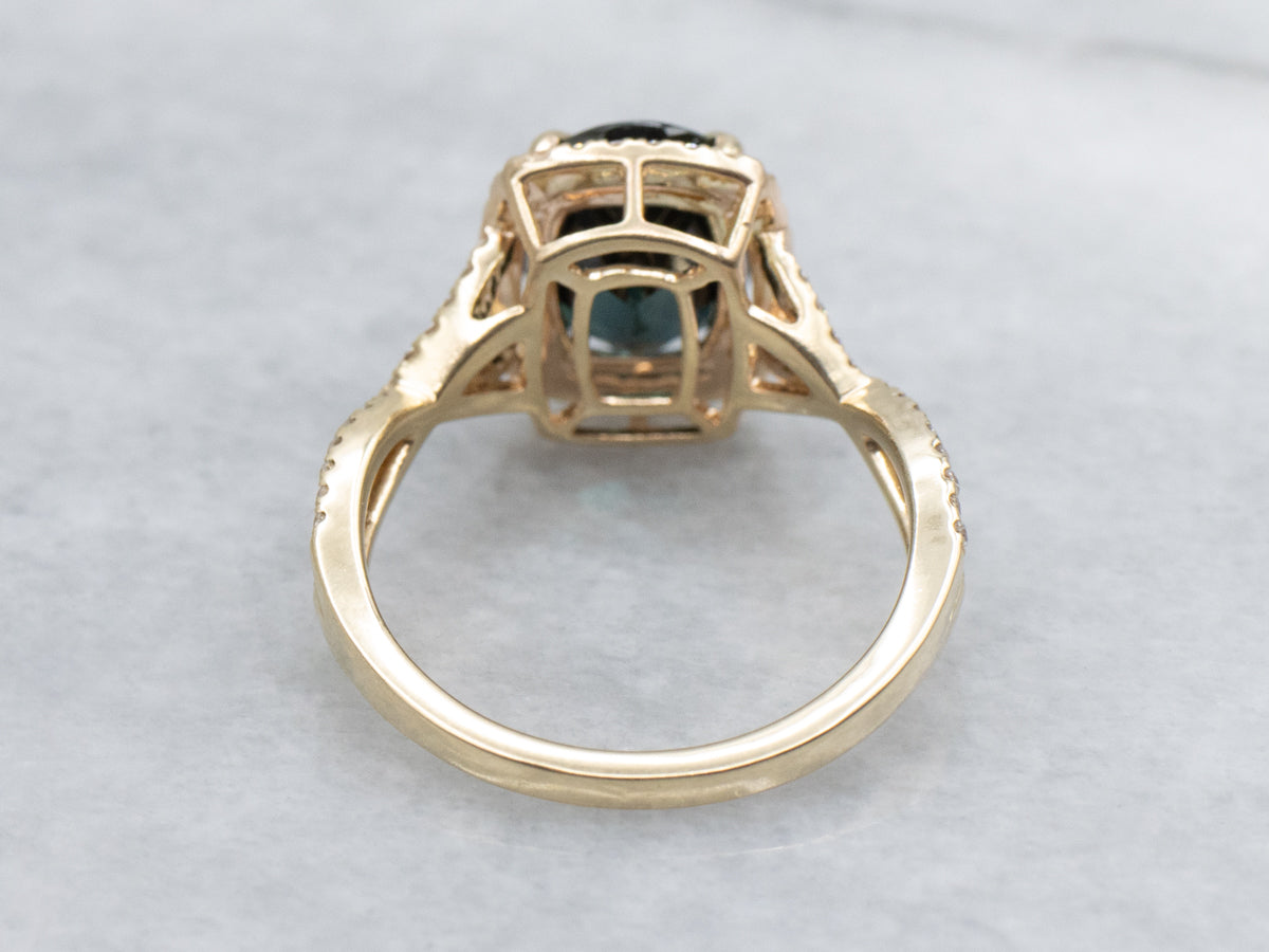 Modern Yellow Gold Sapphire and Diamond Halo Ring