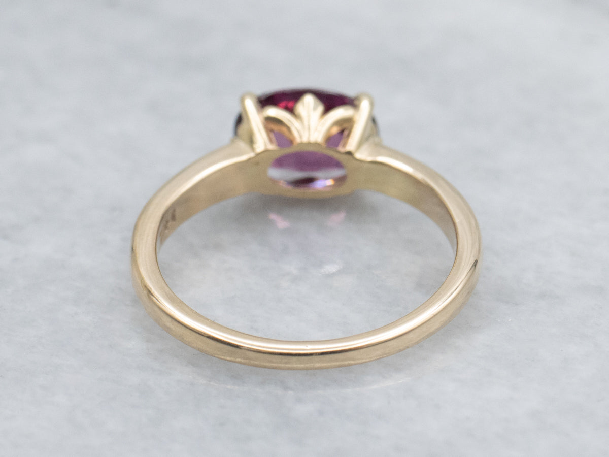East to West Oval Cut Garnet Yellow Gold Solitaire Ring