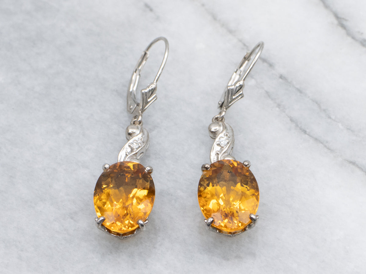 Oval Cut Citrine and Diamond Swirl White Gold Drop Earrings