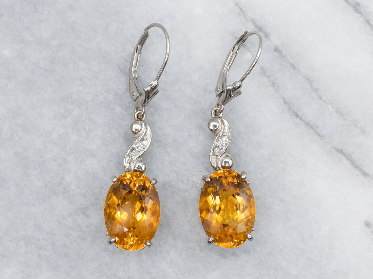 Oval Cut Citrine and Diamond Swirl White Gold Drop Earrings