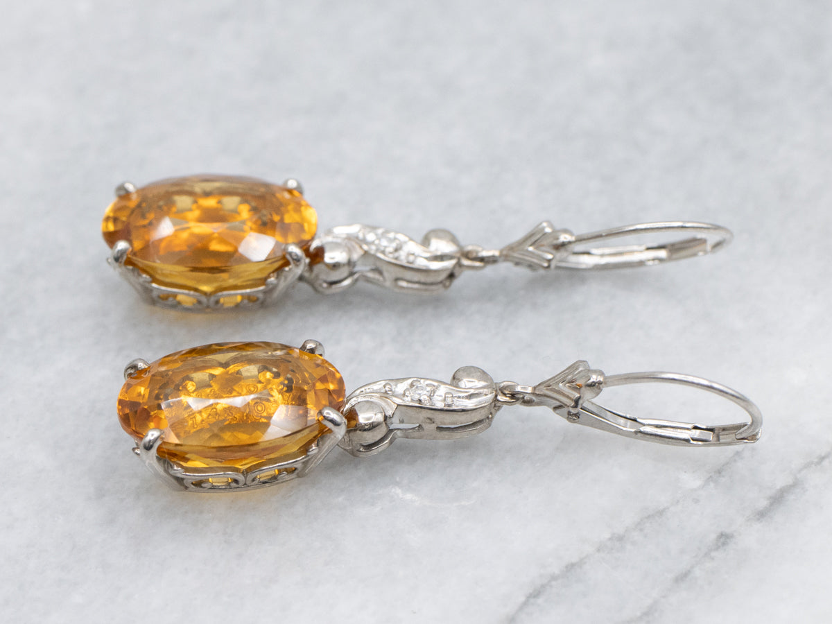 Oval Cut Citrine and Diamond Swirl White Gold Drop Earrings