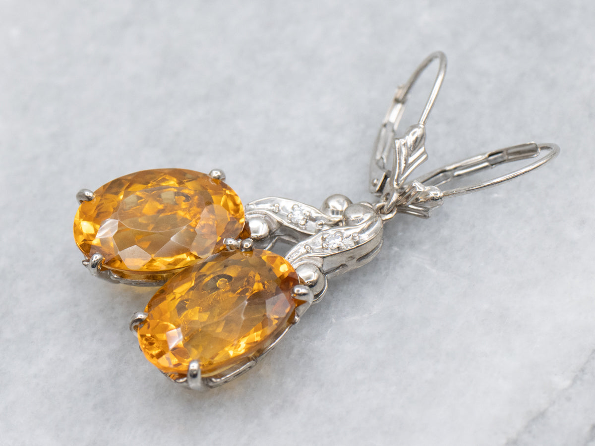 Oval Cut Citrine and Diamond Swirl White Gold Drop Earrings