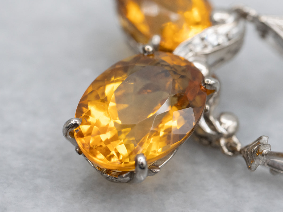Oval Cut Citrine and Diamond Swirl White Gold Drop Earrings
