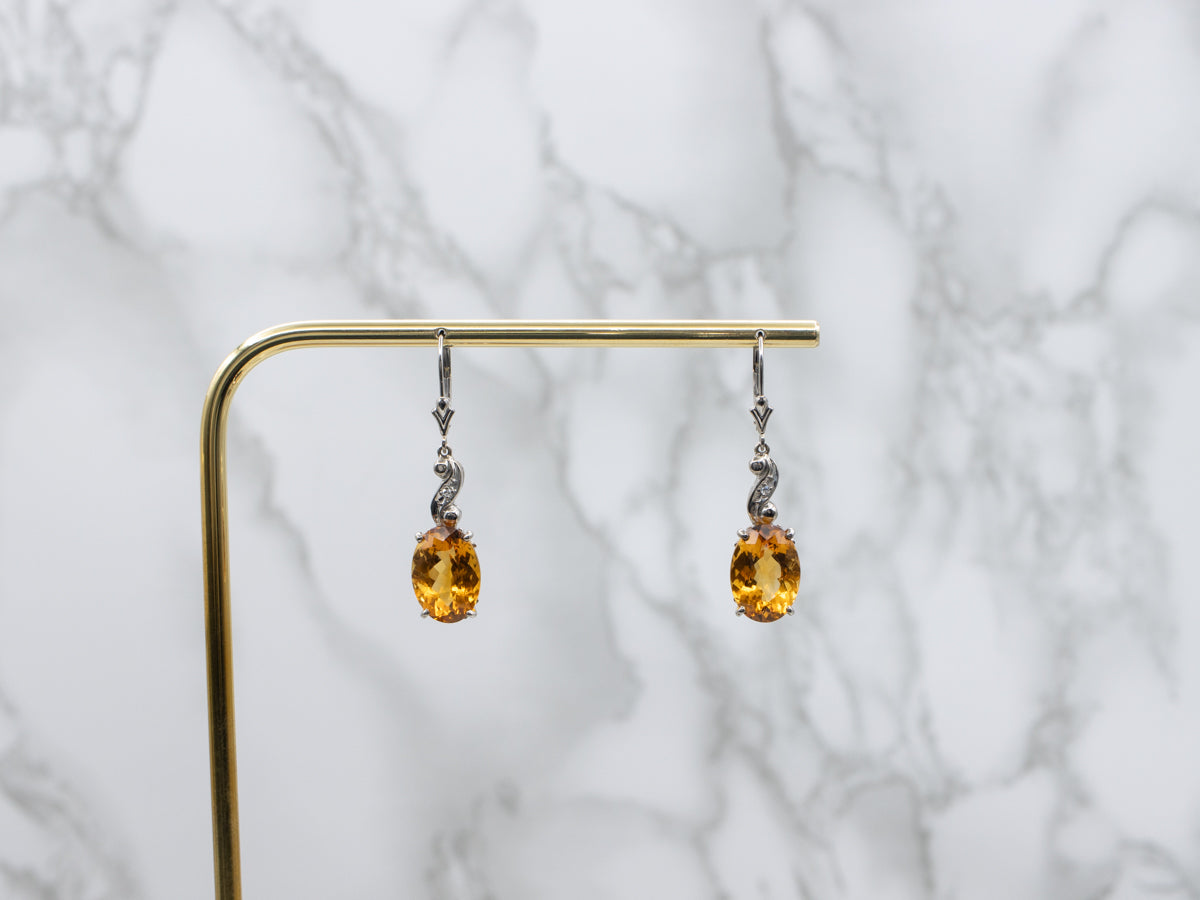 Oval Cut Citrine and Diamond Swirl White Gold Drop Earrings