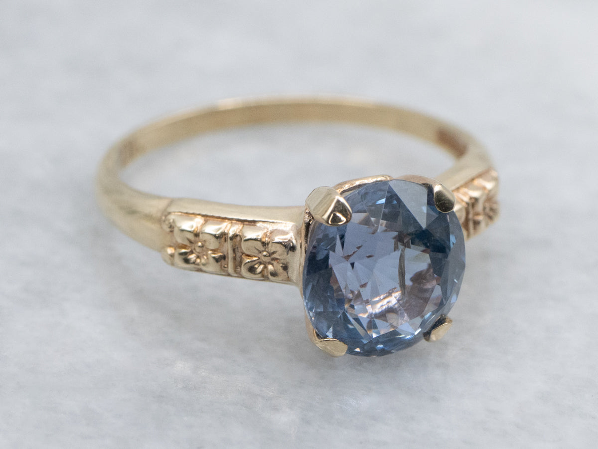 Indigo-Hued Spinel in Vintage Gold Floral Solitaire Setting