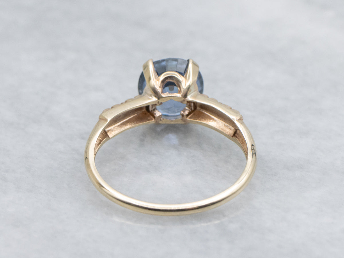 Indigo-Hued Spinel in Vintage Gold Floral Solitaire Setting