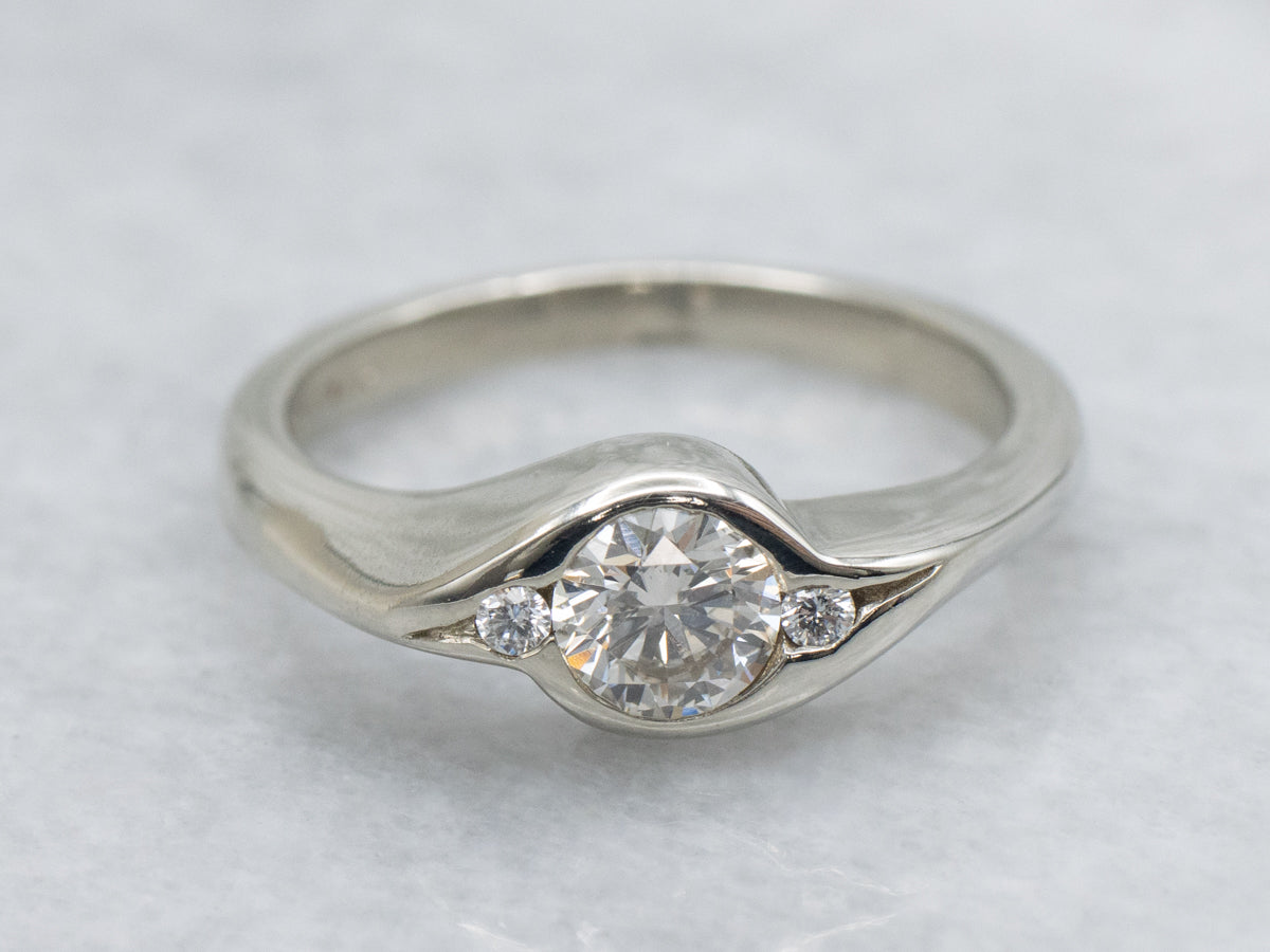 Sleek Semi-Bezel Set Three Stone Diamond Engagement Ring