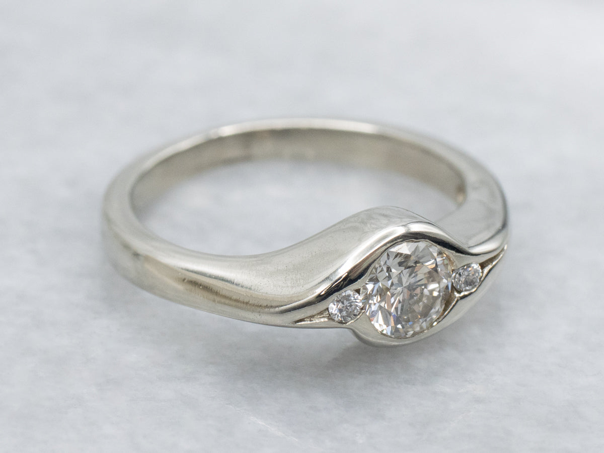 Sleek Semi-Bezel Set Three Stone Diamond Engagement Ring
