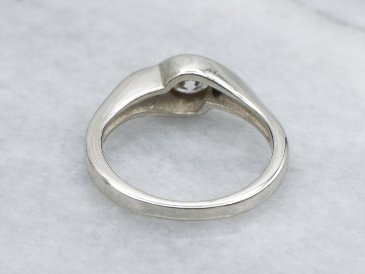 Sleek Semi-Bezel Set Three Stone Diamond Engagement Ring