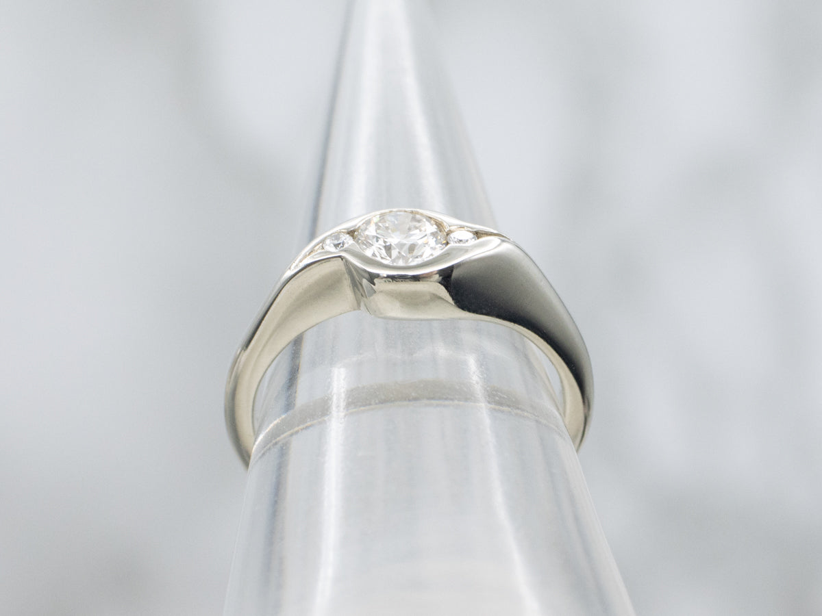 Sleek Semi-Bezel Set Three Stone Diamond Engagement Ring