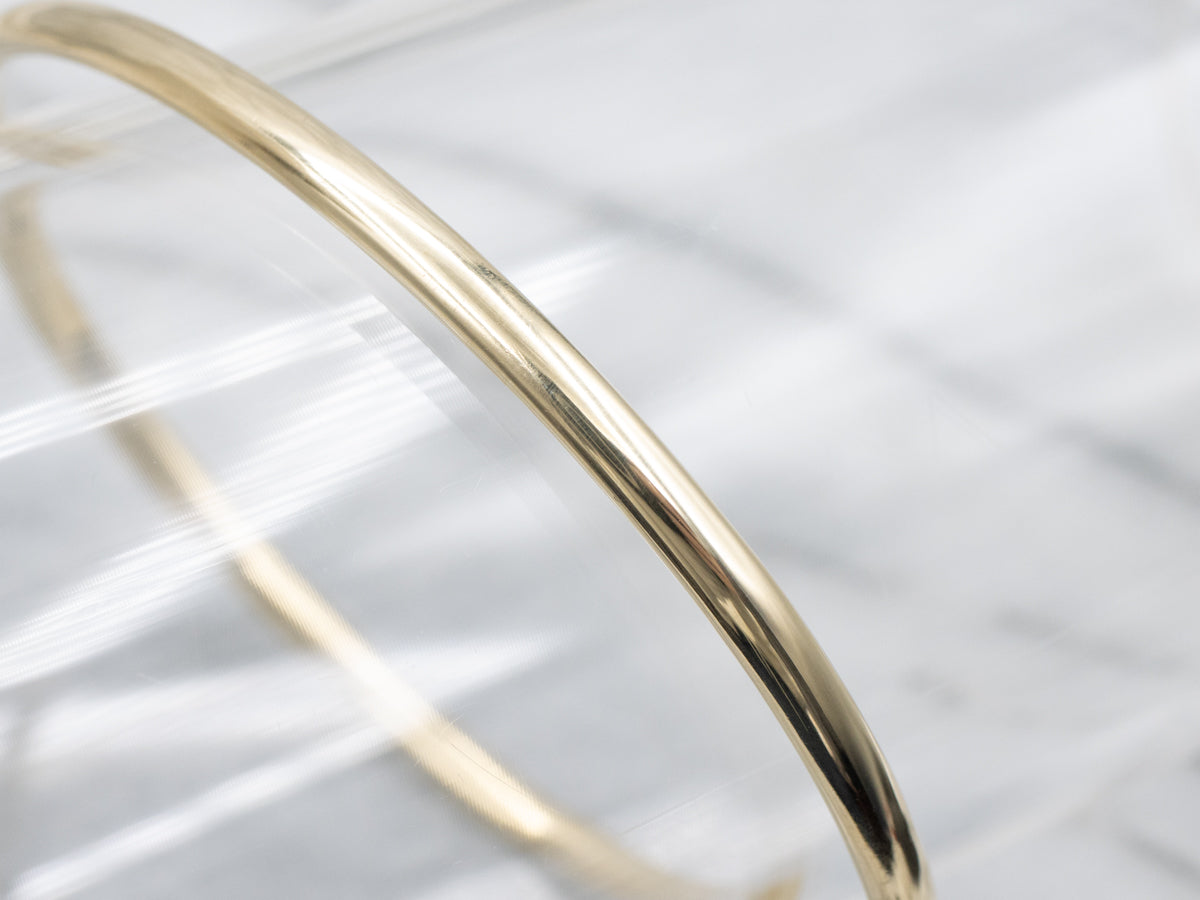 Sleek Polished Yellow Gold Hinged Bangle Bracelet
