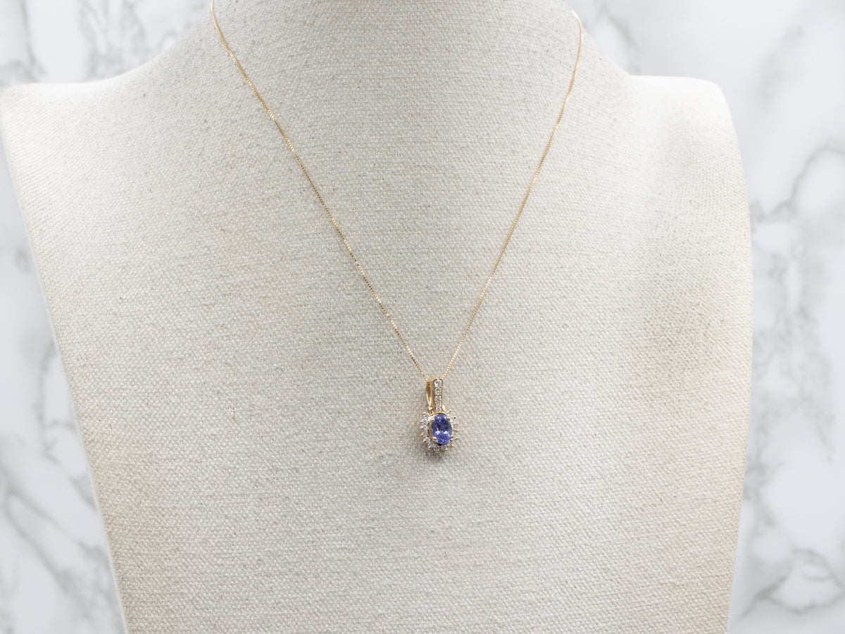 Modern Tanzanite and Diamond Halo Pendant