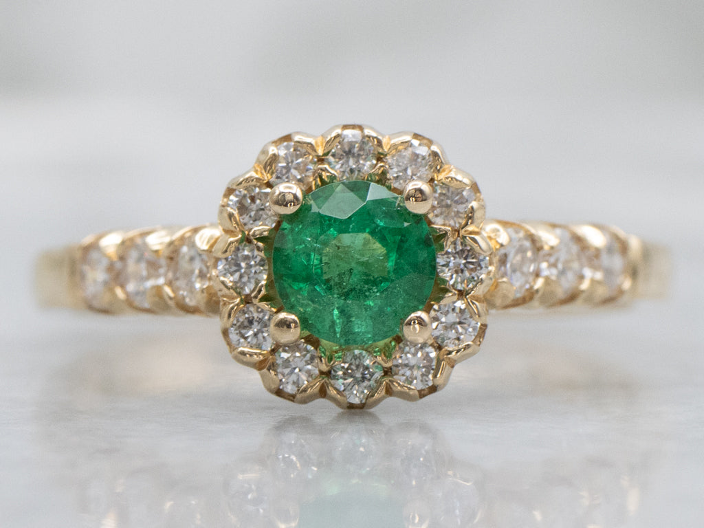 Modern Yellow Gold Emerald and Diamond Halo Ring